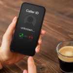Smartphone with unknown caller on screen, understanding robocalls