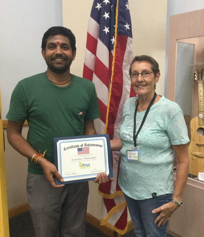 Pam, Literacy Volunteer with Ganesha, her student with his certificate of acheivement for becoming a US Citizen