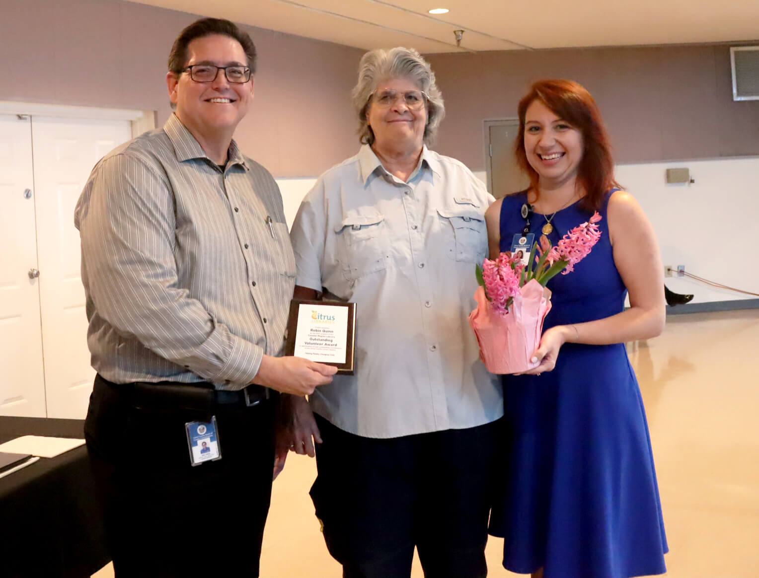 Library Director, Eric Head; Outstanding Volunteer award winner, Robin Quinn; Coastal Region Library Customer Service Specialist, Alexus Medina