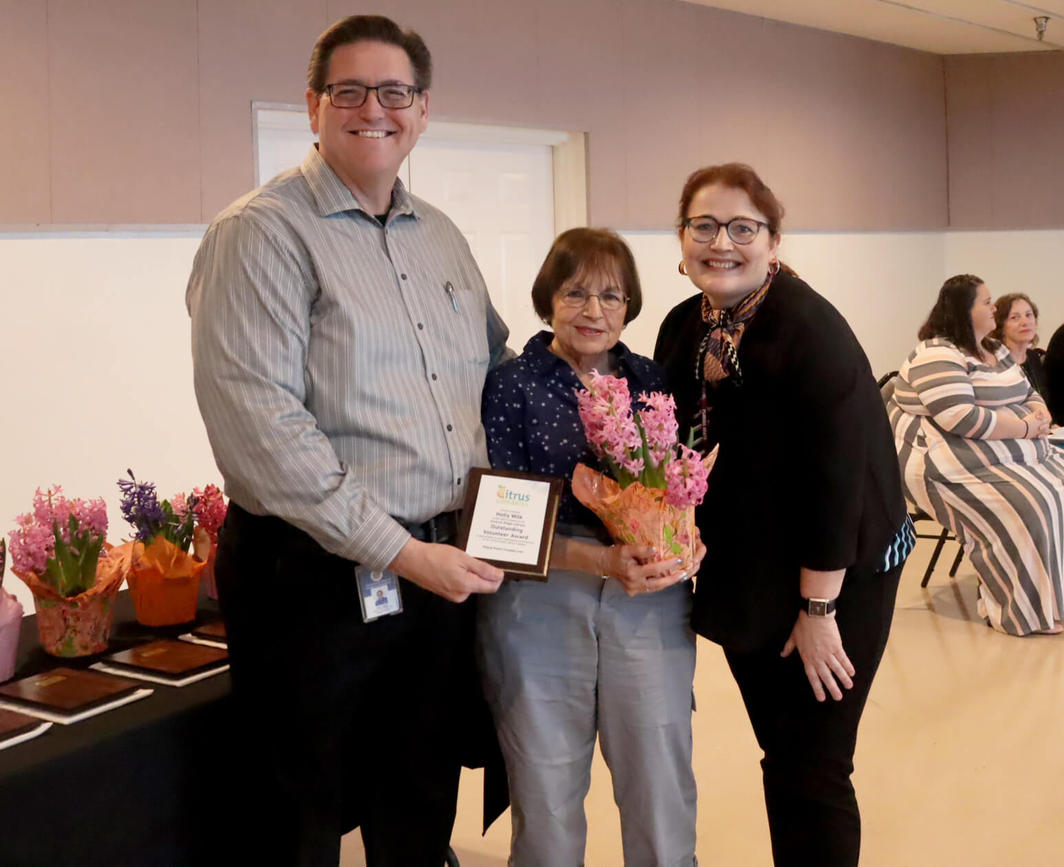 Library Director, Eric Head; Outstanding Volunteer award winner, Holly Wilk; Central Ridge Library Customer Service Specialist, Maria Rucinski