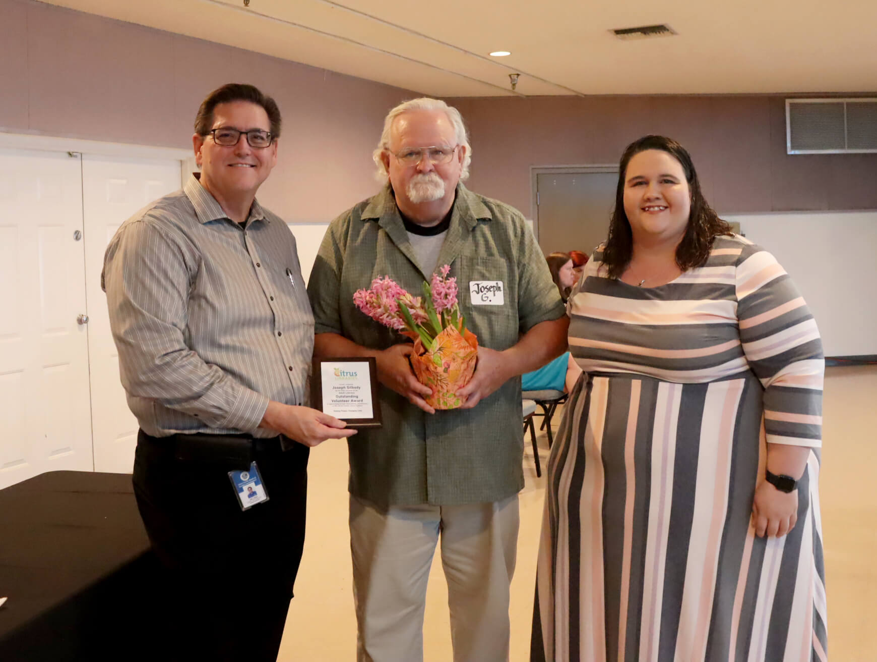 Library Director, Eric Head; Outstanding Literacy Volunteer award winner, Joseph Gilbody; Floral City Branch Supervisor April Frazier