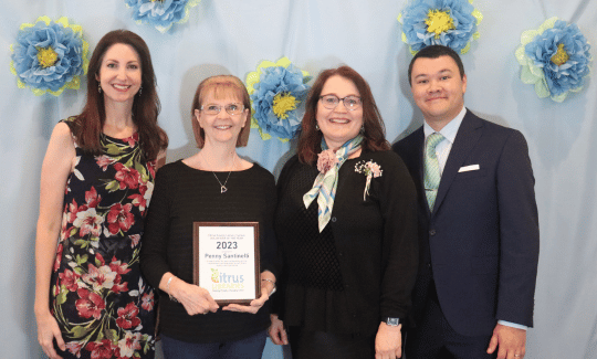 Pictured L to R: Danielle Damato-Doty, Central Ridge Branch Supervisor; Penny Santinelli, Award Winner; Maria Rucinski. Central Ridge Customer Service Specialist; Adam Chang, Library Director.